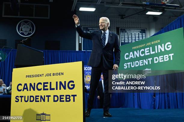 President Joe Biden waves after speaking about student loan debt relief at Madison Area Technical College in Madison, Wisconsin, April 8, 2024.