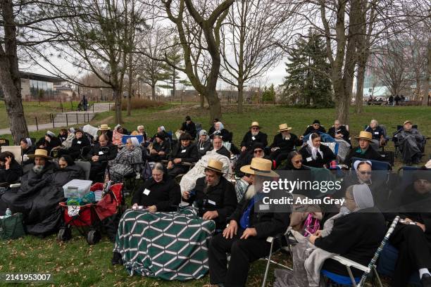 Members of the Amish community sit to watch the Solar Eclipse on April 8, 2024 in Niagara Falls, New York. Millions of people have flocked to areas...