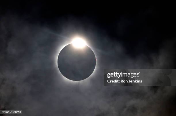 The diamond ring effect is seen as the moon eclipses the sun on April 8, 2024 in Fort Worth, Texas. Millions of people have flocked to areas across...