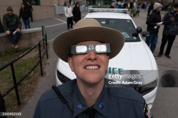 Member of New York State Park Police watches the partial Solar Eclipse on April 8, 2024 in Niagara Falls, New York. Millions of people have flocked...