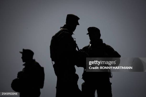 Soldiers of the German armed forces Bundeswehr take part in an urban combat training scenario during the international military exercise Wettiner...