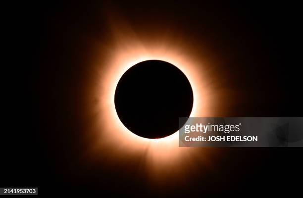 The moon eclipses the sun during a total solar eclipse across North America, in Bloomington, Indiana, on April 8, 2024. This year's path of totality...