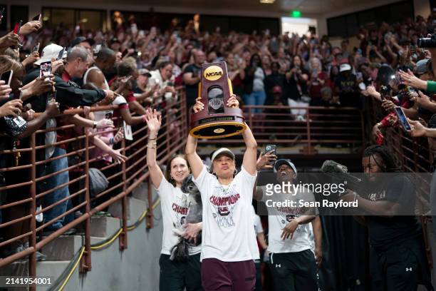 South Carolina coach Dawn Staley raises the NCAA Women's Basketball Championship trophy at a celebration at the Colonial Life Arena on April 8, 2024...
