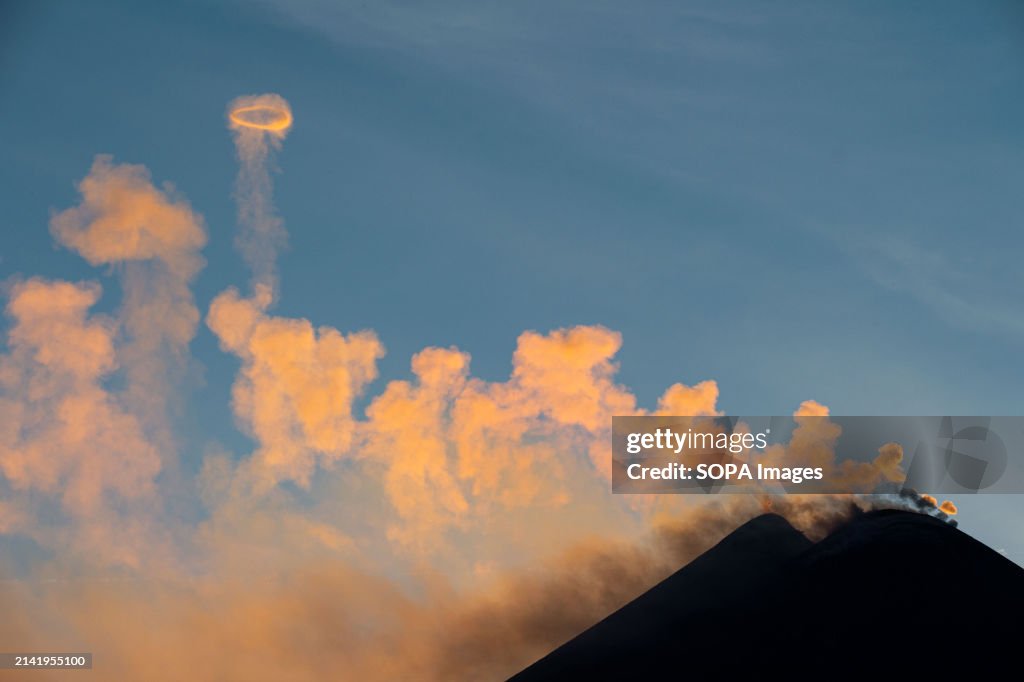 Etna at sunset, emitting its gas rings...
