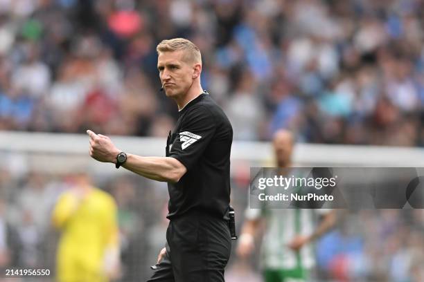 Referee Scott Oldham is gesturing during the EFL Trophy match between Peterborough and Wycombe Wanderers at Wembley Stadium in London, on April 7,...