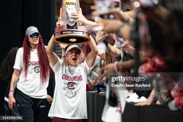 South Carolina coach Dawn Staley raises the NCAA Women's Basketball Championship trophy during a celebration at Colonial Life Arena on April 8, 2024...