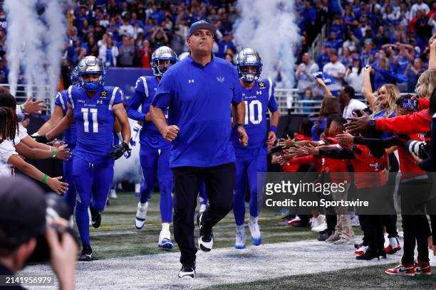 St Louis Battlehawks head coach Anthony Becht leads his team onto the field during the USL football game between the Arlington Renegades and the St....