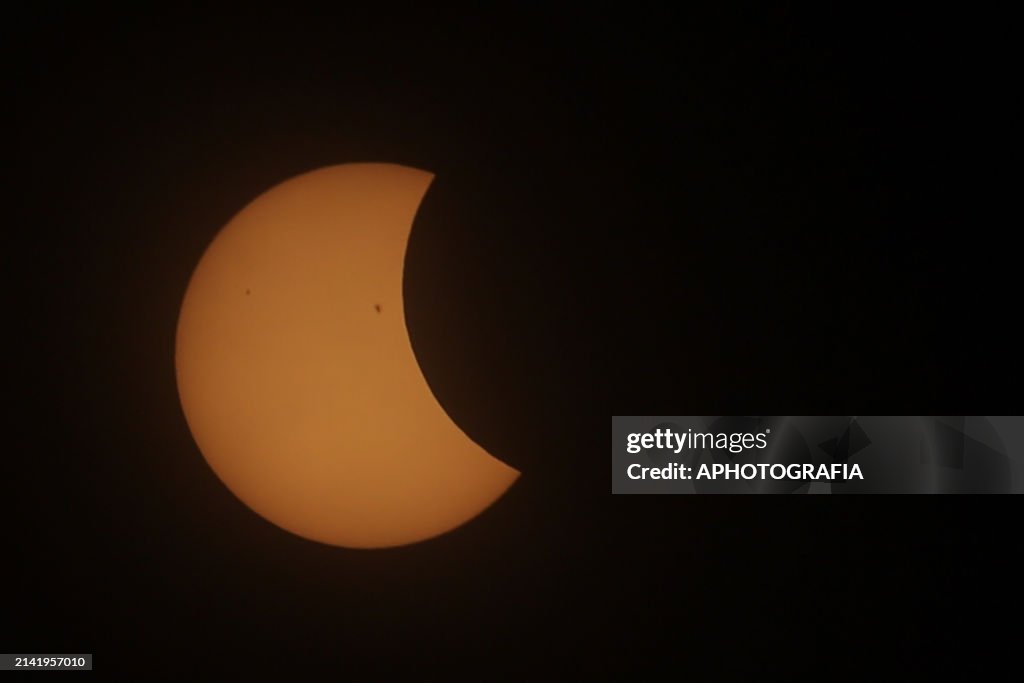 Half Eclipse A view of the alignment of the moon with the sun during a partial ...