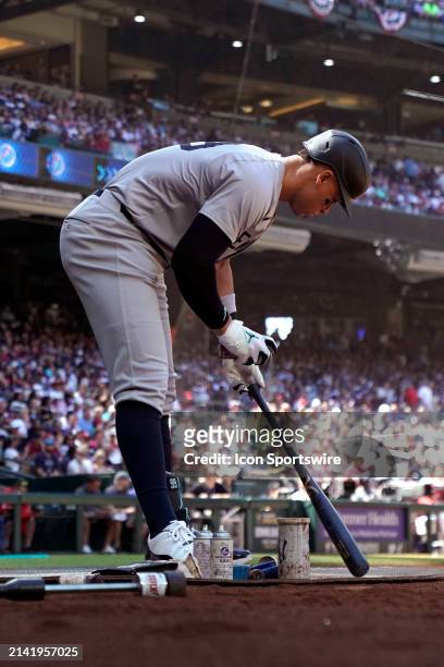 New York Yankees outfielder Aaron Judge tens to his bat in the on-deck circle during a MLB game between the Arizona Diamondbacks and New York Yankees...