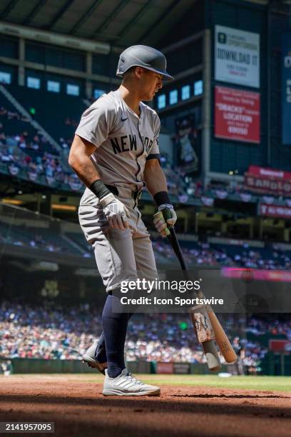 New York Yankees infielder Anthony Volpe loosens up in the on-deck circle during a MLB game between the Arizona Diamondbacks and New York Yankees on...