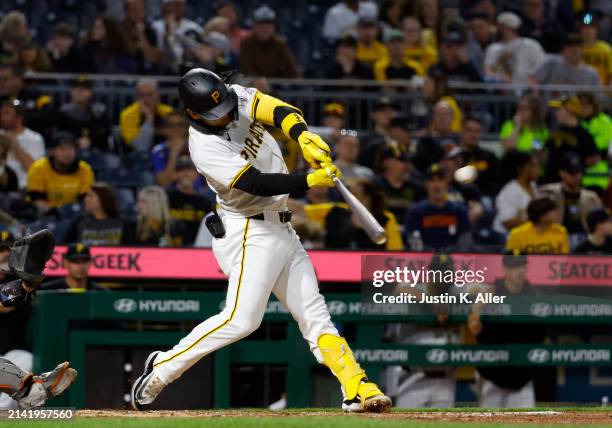 Connor Joe of the Pittsburgh Pirates hits an RBI double in the fifth inning against the Detroit Tigers during inter-league play at PNC Park on April...