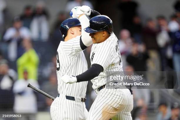 Juan Soto of the New York Yankees celebrates with teammate Aaron Judge after hitting a three-run home run in the fourth inning during the game...