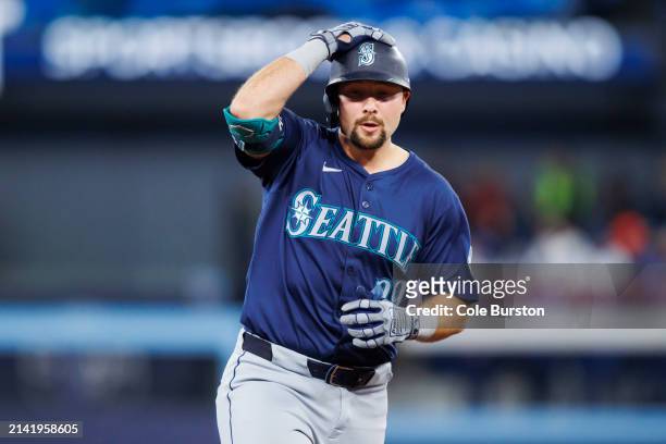 Cal Raleigh of the Seattle Mariners rounds the bases on his home run in the ninth inning of their MLB game against the Toronto Blue Jays at Rogers...