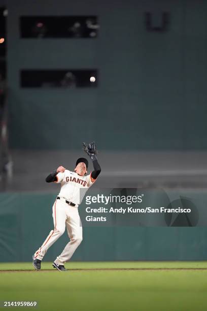 Nick Ahmed of the San Francisco Giants fields a fly ball at Oracle Park on April 8, 2023 in San Francisco, California.