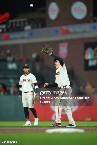 Wilmer Flores of the San Francisco Giants fields a fly ball at Oracle Park on April 8, 2023 in San Francisco, California.