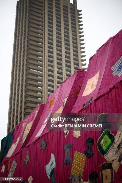 An artwork entitled 'Purple Hibiscus' by Ghanaian artist Ibrahim Mahama is pictured at the Barbican centre in central London on April 9, 2024. The...