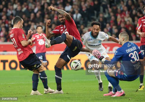 Alexsandro Ribeiro of Lille, Pierre-Emerick Aubameyang of Marseille, Lille goalkeeper Lucas Chevalier in action during the Ligue 1 Uber Eats match...