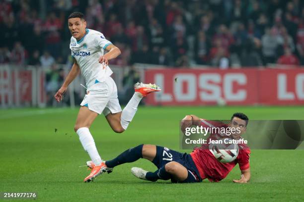 Amine Harit of Marseille, Benjamin Andre of Lille in action during the Ligue 1 Uber Eats match between Lille OSC and Olympique de Marseille at Stade...