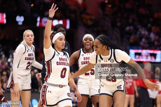 Te-Hina Paopao and Bree Hall of the South Carolina Gamecocks react after a three point basket in the second half during the NCAA Women's Basketball...