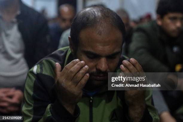 Palestinian Muslims celebrate Laylat al-Qadr on the ruins of the Al-Farouq Mosque on April 06, 2024 in Rafah, Gaza. Al-Farouq Mosque had been...