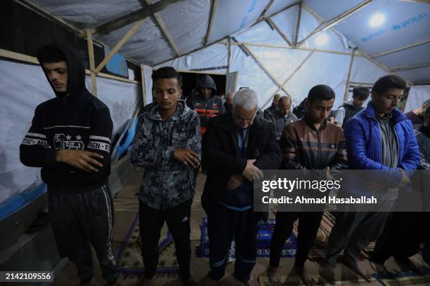 Palestinian Muslims celebrate Laylat al-Qadr on the ruins of the Al-Farouq Mosque on April 06, 2024 in Rafah, Gaza. Al-Farouq Mosque had been...