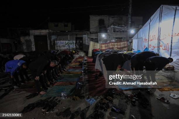 Palestinian Muslims celebrate Laylat al-Qadr on the ruins of the Al-Farouq Mosque on April 06, 2024 in Rafah, Gaza. Al-Farouq Mosque had been...