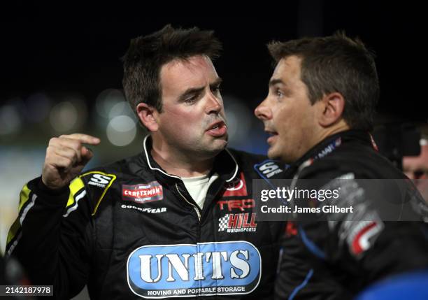 Timmy Hill, driver of the Coble Enterprises/UNITS Toyota, and Stewart Friesen, driver of the Aim Autism/Halmar Toyota, have a heated conversation on...