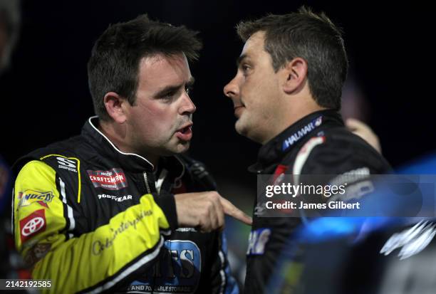 Timmy Hill, driver of the Coble Enterprises/UNITS Toyota, and Stewart Friesen, driver of the Aim Autism/Halmar Toyota, have a heated conversation on...