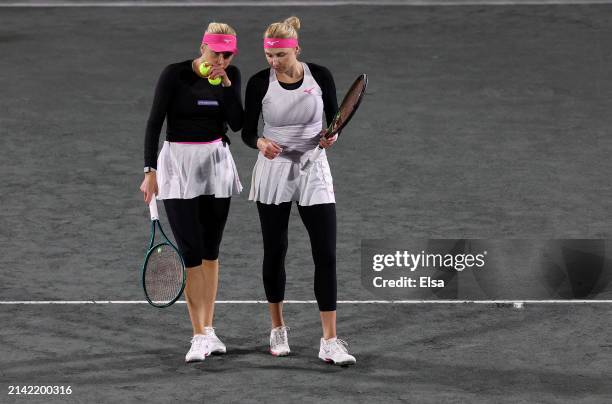 Lyudmyla Kichenok and Nadiia Kichenok of the Ukraine discuss in the first set against Nicole Melichar-Martinez of the United States and Ellen Perez...