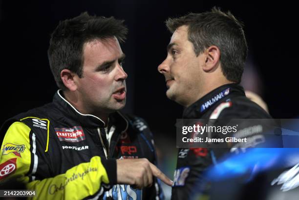 Timmy Hill, driver of the Coble Enterprises/UNITS Toyota, and Stewart Friesen, driver of the Aim Autism/Halmar Toyota, have a heated conversation on...