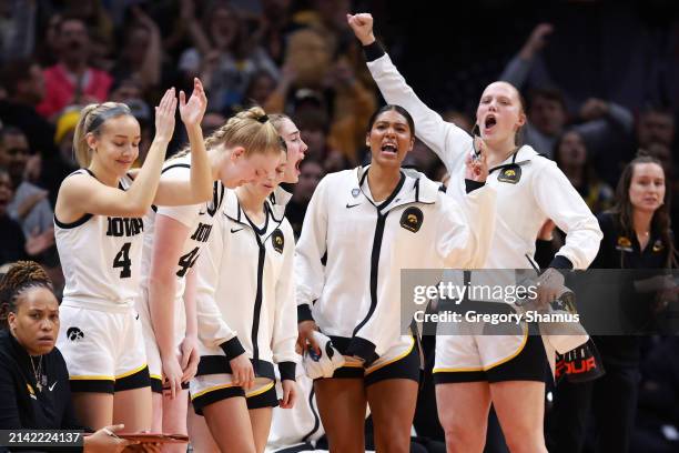 The Iowa Hawkeyes bench reacts in the first half during the NCAA Women's Basketball Tournament Final Four semifinal game against the UConn Huskies at...