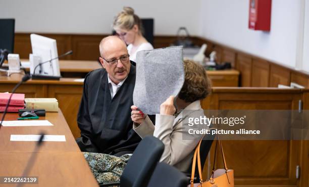 April 2024, Lower Saxony, Lüneburg: The defendant sits next to her defense lawyer Norbert Lösing in the district court. The trial against a...
