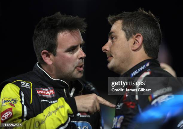 Timmy Hill, driver of the Coble Enterprises/UNITS Toyota, and Stewart Friesen, driver of the Aim Autism/Halmar Toyota, have a heated conversation on...