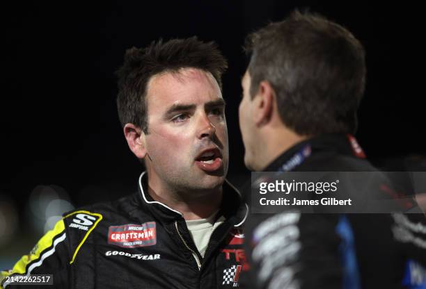 Timmy Hill, driver of the Coble Enterprises/UNITS Toyota, and Stewart Friesen, driver of the Aim Autism/Halmar Toyota, have a heated conversation on...