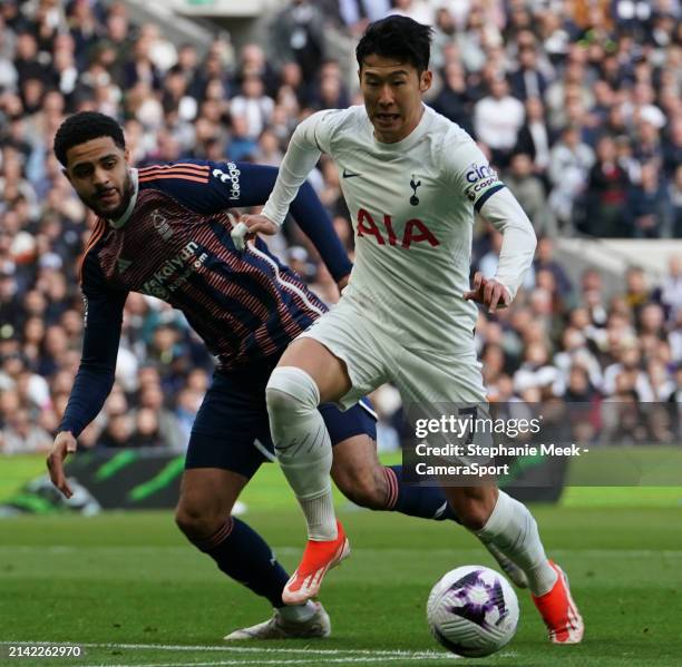 Tottenham Hotspur's Son Heung-Min under pressure from Nottingham Forest's Andrew Omobamidele during the Premier League match between Tottenham...