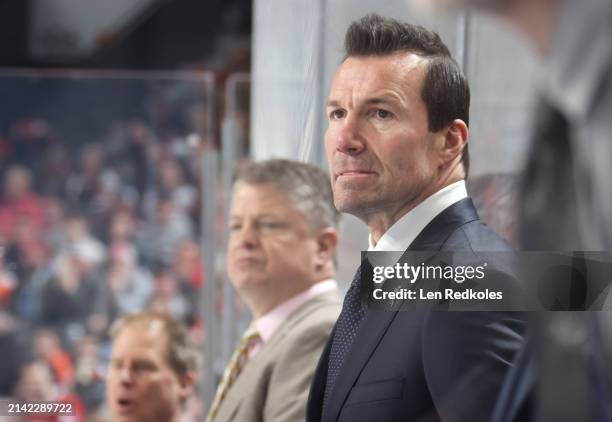 Head Coach of the Chicago Blackhawks Luke Richardson looks on from his bench during the first period against the Philadelphia Flyers at the Wells...