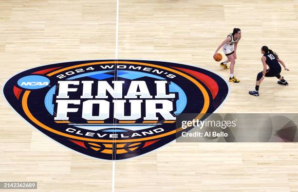 Caitlin Clark of the Iowa Hawkeyes handles the ball against Nika Muhl of the Connecticut in the second half during the NCAA Women's Basketball...