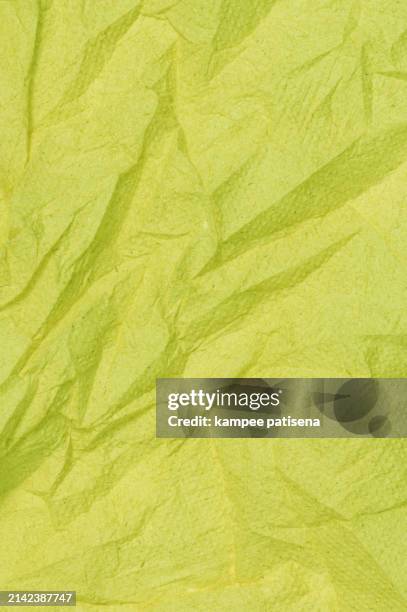 abstract background from texture of yellow napkin paper. - seamless parchment stock pictures, royalty-free photos & images