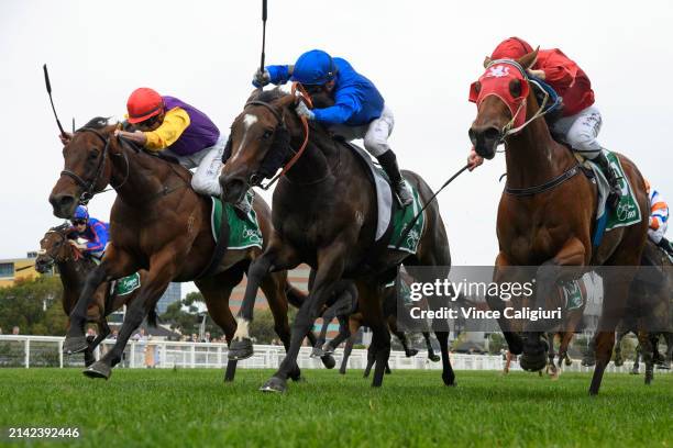 Daniel Stackhouse riding Inhibitions defeats Linda Meech riding Moesha and Miss Aria in Race 4, the Evergreen Turf Bert Bryant Handicap, during...