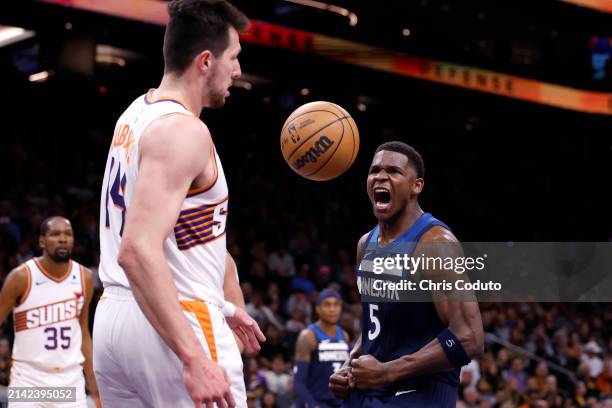 Anthony Edwards of the Minnesota Timberwolves reacts after dunking during the second half against the Phoenix Suns at Footprint Center on April 05,...