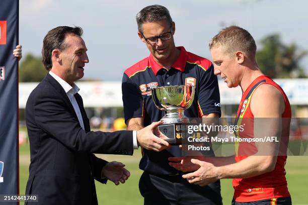 Andrew Dillon, CEO of the AFL presents the State Cup to Jade Rawlings, coach of South Australia and Captain, Joseph Sinor of South Australia after...