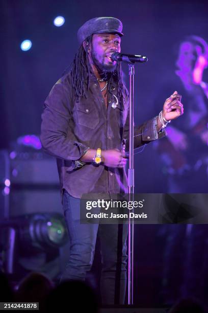 Eric Burton and Black Pumas perform live on stage at Ryman Auditorium on April 05, 2024 in Nashville, Tennessee.