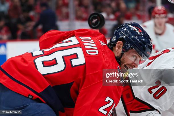Nic Dowd of the Washington Capitals watches the puck against the Carolina Hurricanes during the third period of the game at Capital One Arena on...