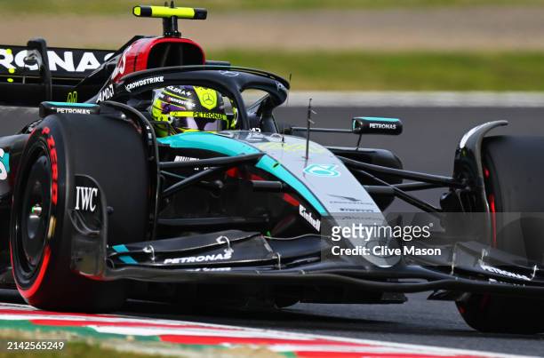 Lewis Hamilton of Great Britain driving the Mercedes AMG Petronas F1 Team W15 on track during qualifying ahead of the F1 Grand Prix of Japan at...