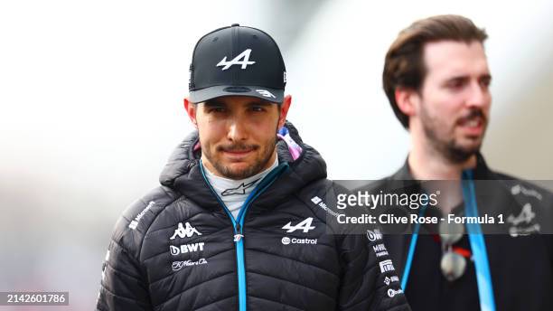 15th placed qualifier Esteban Ocon of France and Alpine F1 walks in the Paddock during qualifying ahead of the F1 Grand Prix of Japan at Suzuka...