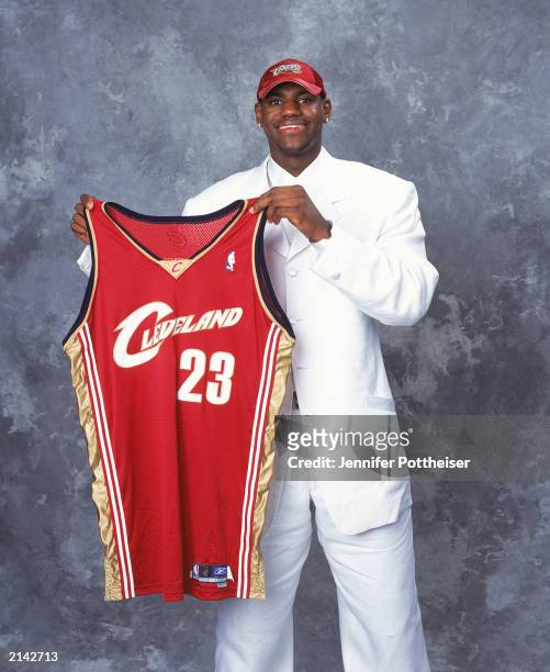 LeBron James of the Cleveland Cavaliers poses with his jersey during the 2003/2004 NBA Draft Portrait at Paramount Theatre Madison Square Garden on...