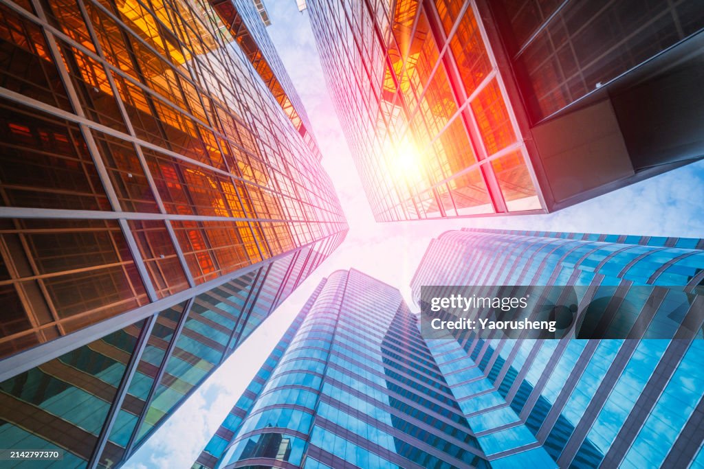 Golden facade office building ,window abstract from under view