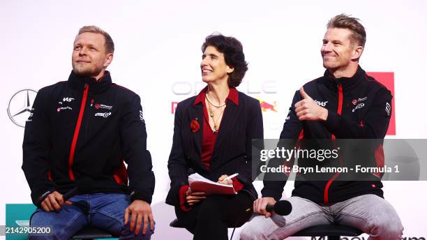 Kevin Magnussen of Denmark and Haas F1 and Nico Hulkenberg of Germany and Haas F1 talk to the crowd on the fan stage after qualifying ahead of the F1...