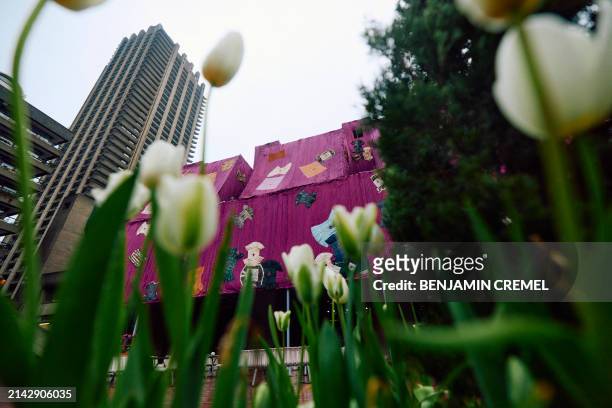 An artwork entitled 'Purple Hibiscus' by Ghanaian artist Ibrahim Mahama is pictured at the Barbican centre in central London on April 9, 2024. The...