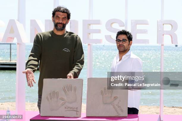 Ramzy Bedia and Jamel Debbouze display their Hand Prints at the "Terminal" Photocall during the 7th Canneseries International Festival on April 06,...